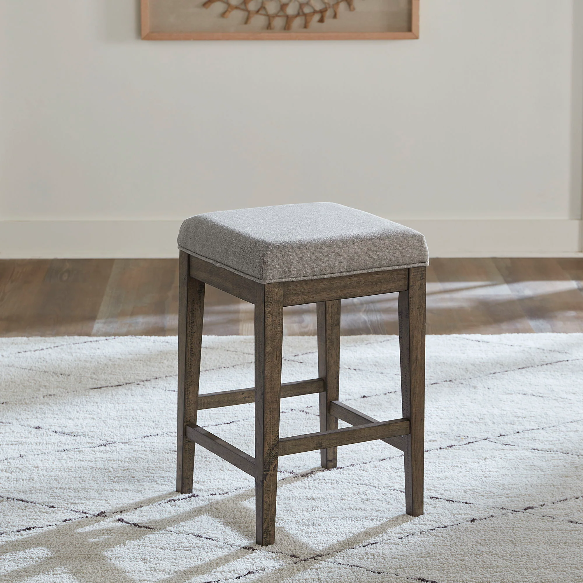 Arrowcreek – Upholstered Console Stool – Weathered Stone